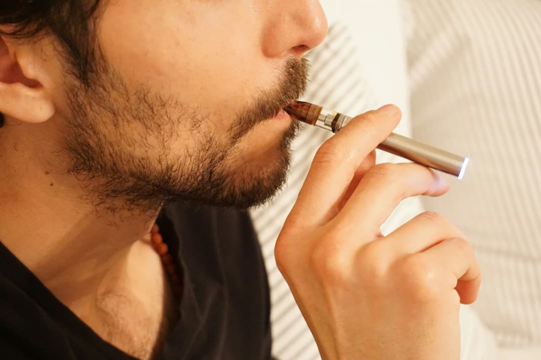Man smoking an e-cigarette.